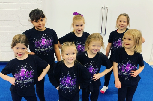 Group of smiling children at cheer for fun